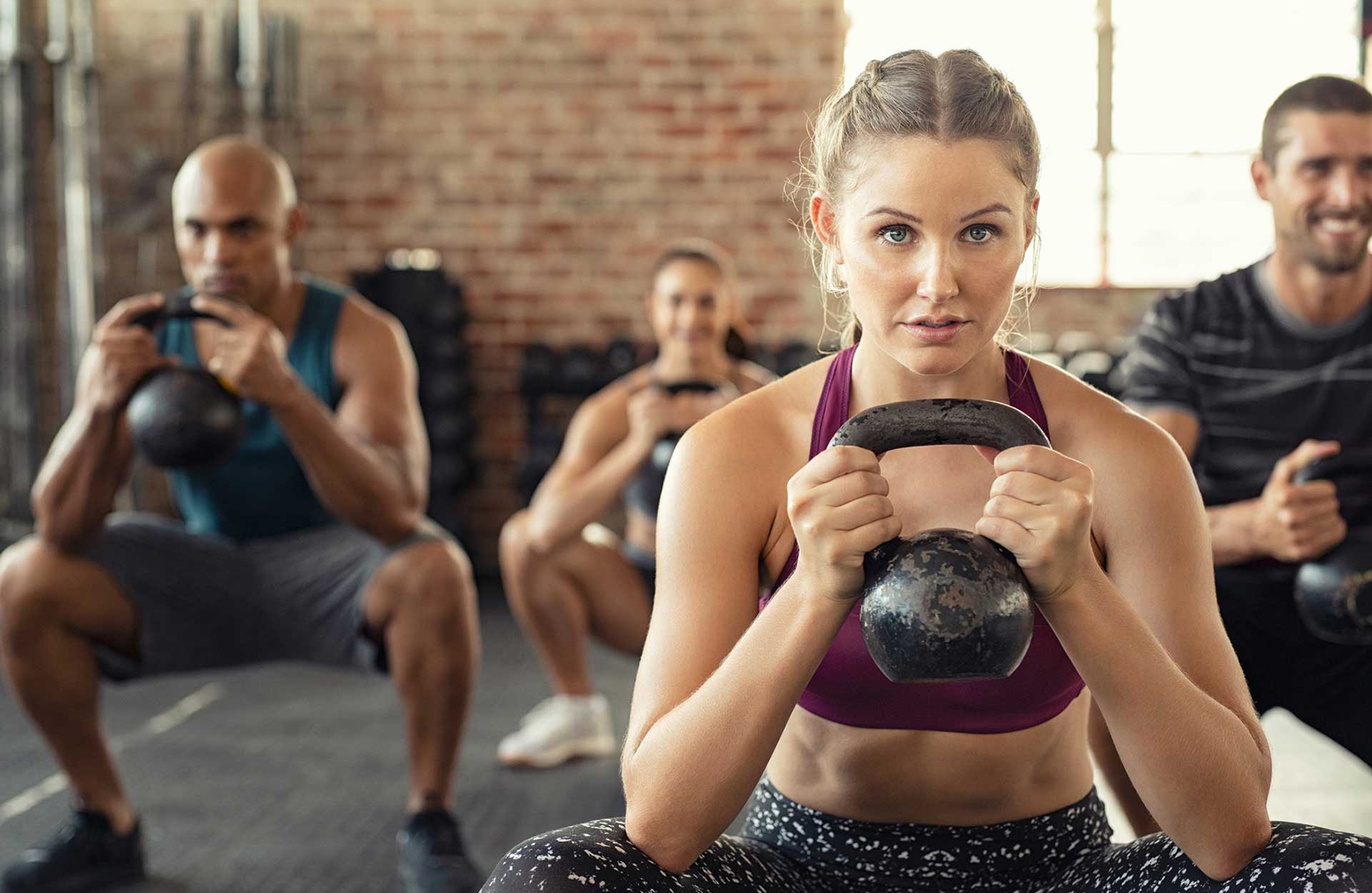 Fitness class with kettlebells